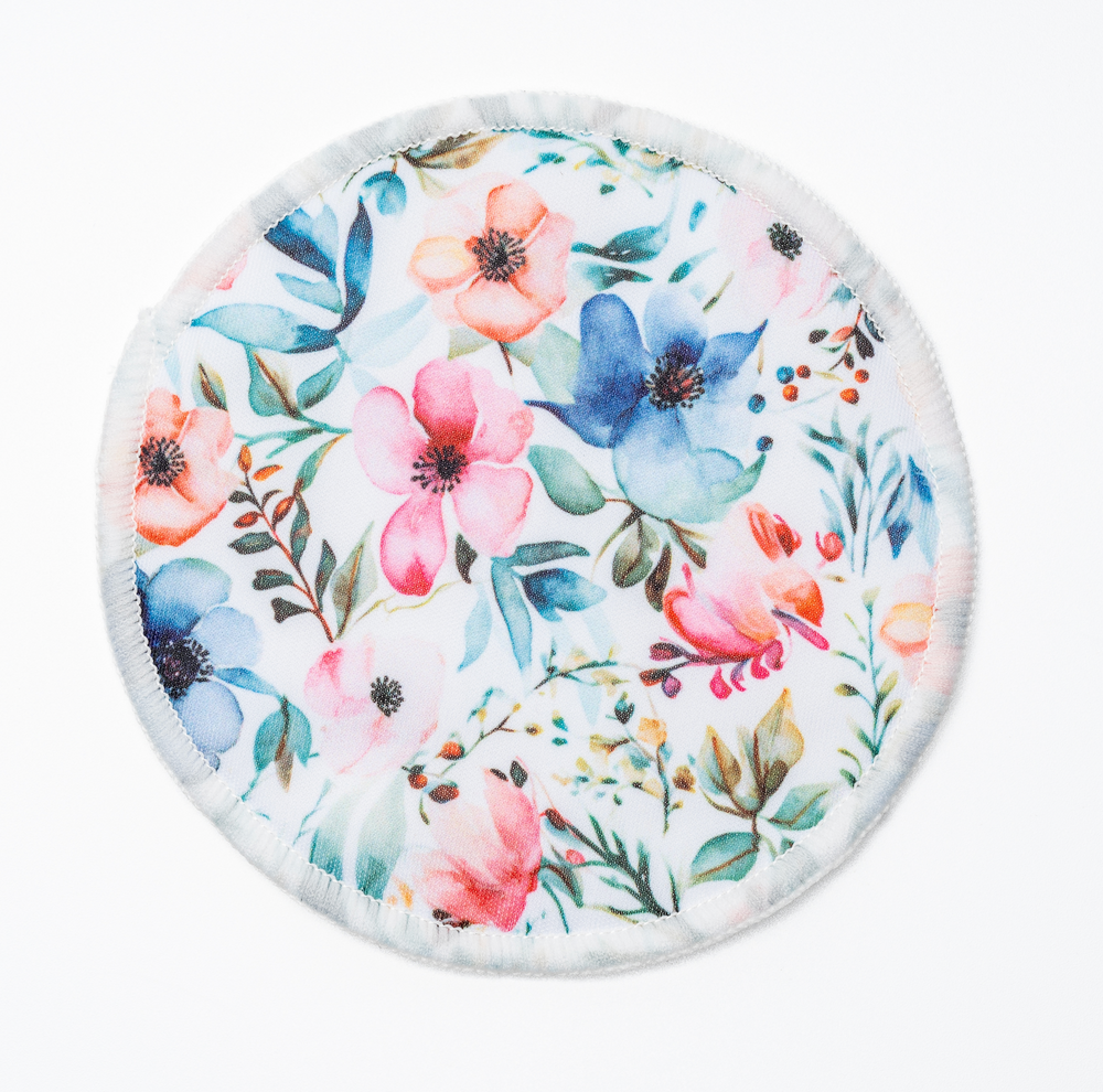 Floral printed outer layer of a CAE reusable bamboo nursing pad